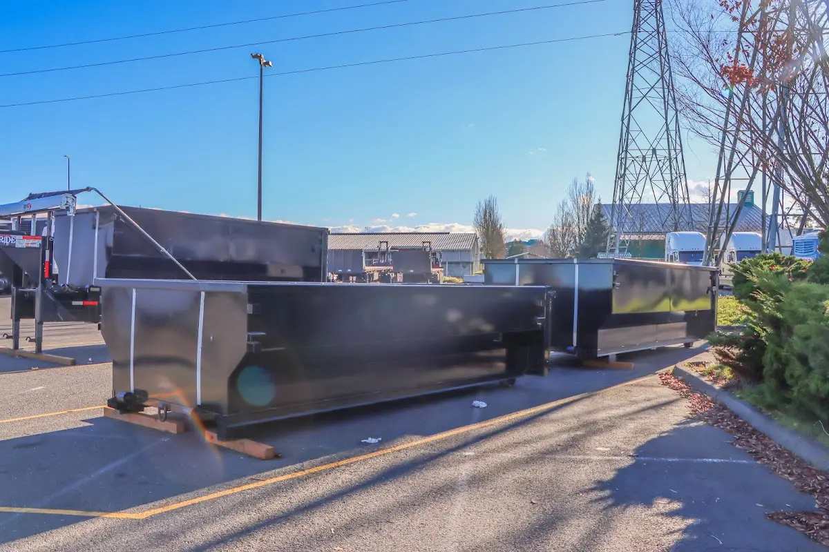Roll-off dumpster ready for waste disposal at job site for Commercial Dumpster Rental in Newton